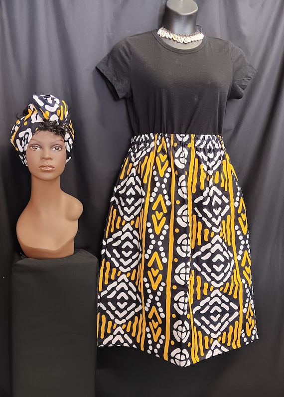 African Print straight Skirt with head wrap. Print colors are yellow, black, and white, Below knee Headwrap. 100% Cotton. Free Shipping