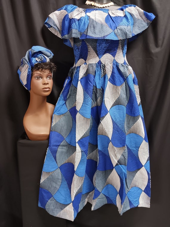 African print Jumper palazzo legs. Sleeveless, over shoulder collar, Elastic top to waist, ankle length, pockets, matching headwrap.
