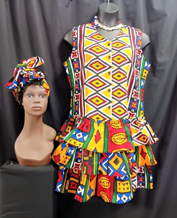 African print Dress, cute Sleeveless with headwrap, button down front to hips. V neck, back stand up collar. 3 ruffle bottom knee length.