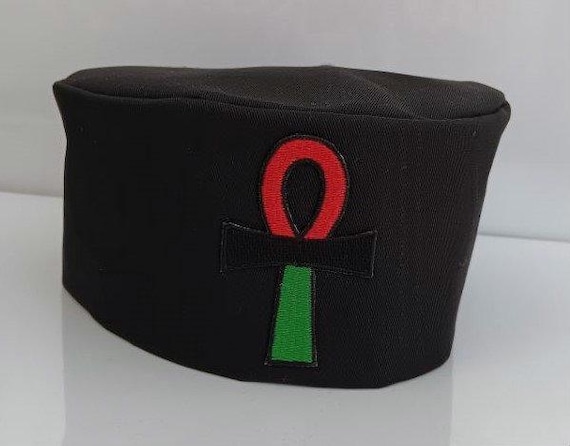 African kufi black hat with red black and green Ankh symbol patch