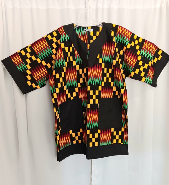African Dashiki Electric diasporia color fabric (Red, black, yellow and green) trimmed in black matching Kufi sold separately.