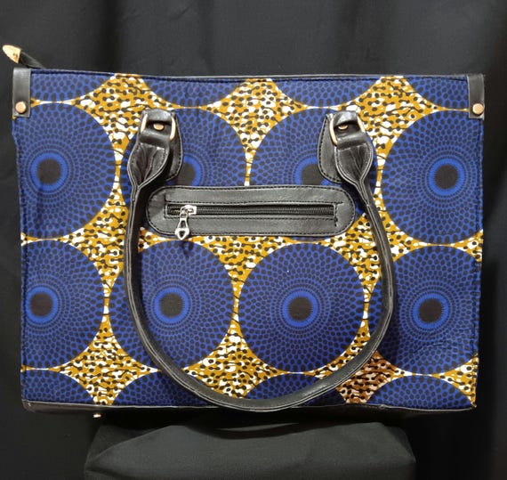 Africa Inspired Tote bag, beautiful African Fabric.  Zipper close top, front zipper pocket, leather hand handle. 20% OFF and FREE Shipping.