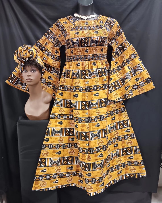 African print Dress. Elastic top to waist, pockets, long flowing full sleeves, ankle length, matching headwrap. 20% off. FREE Shipping.