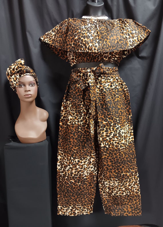 Africa print Women's 3-piece crop top pants set matching headwrap. Sleeveless over shoulder collar elastic waist. Tie belt pants, pockets.