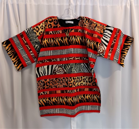African red striped animal print fabric dashiki. This print has all the beautiful color (matching Kufi sold  separately.)