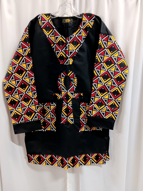 African Dashiki, anhk symbol, colors black, red, yellow and white.Long black sleeves and pockets. Matching Kufi sold  separately.