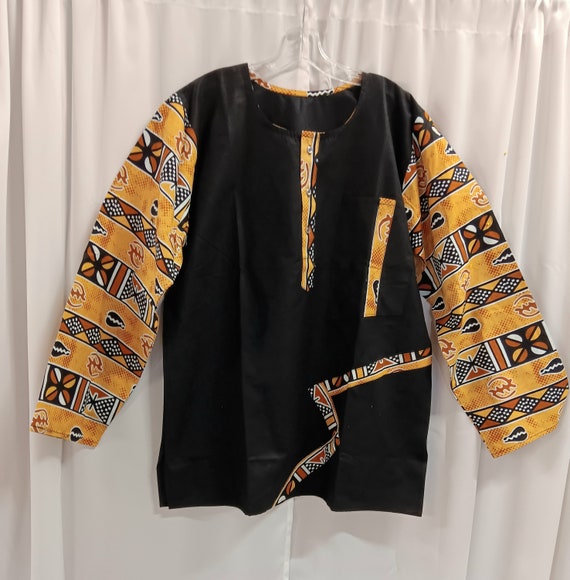 African inspired long sleeve shirt. African print and solid black fabric makes nice contrast. Button down neck.