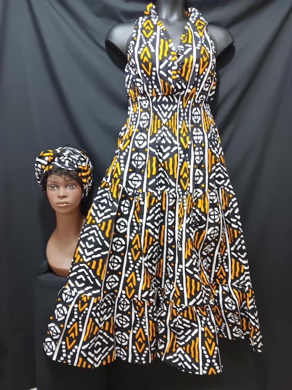 African print Dress and headwrap. Top Sleevess, halter neck, elastic back to waist, 3 button front, ankle length. 20% off and Free Shipping.