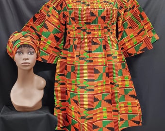 African print Dress. Elastic top to waist, pockets, elbow length full sleeves, below knee length dress with matching headwrap.