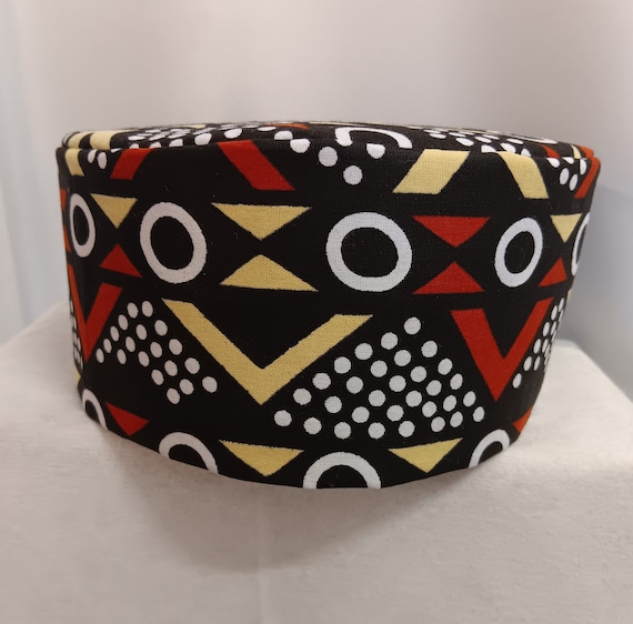 African kufi black, dark reddish brown,  yellow and white print