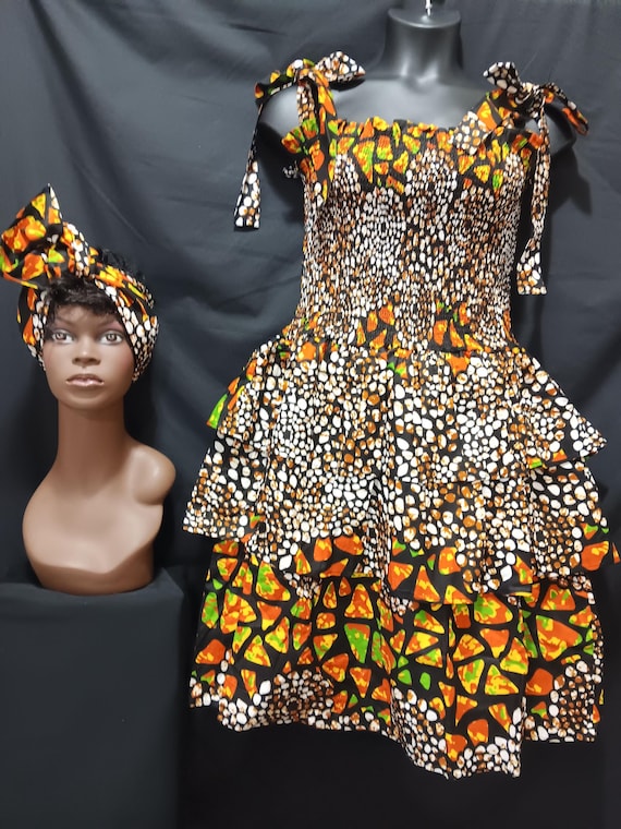 Africa print sun dress with headwrap. Elastic top to waist, tie straps shoulders. Three ruffles waist to bottom. 20% OFF. FREE Shipping.