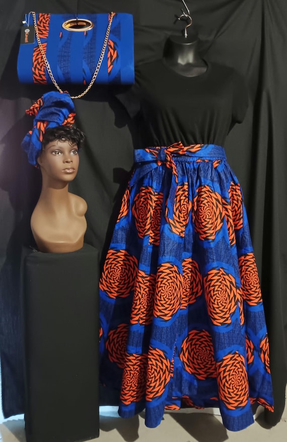 3pc Africa inspired Print Skirt, beautiful colors with pockets. Matching purse and  headwrap. Maxi length skirt . 100% Cotton. Free Shipping