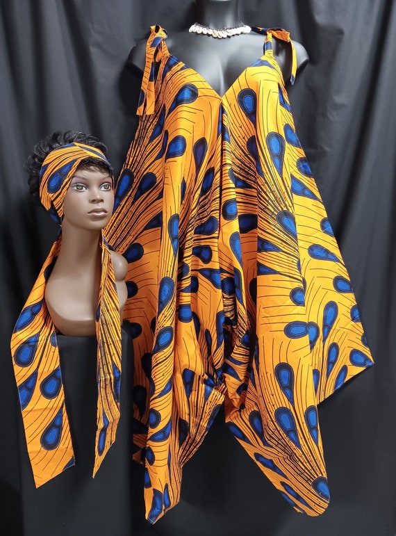 Africa print jumpsuit. Step-in tie at the shoulder and go. Wear with sandals or boots all season cutie. Lovely with top or leggins. Work it.