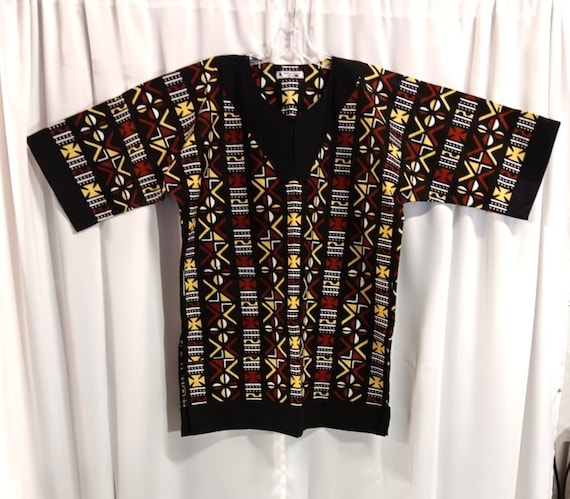 African Dashiki with matching Kufi Black, brown, yellow and White Print trimmed in black, sold  separately.