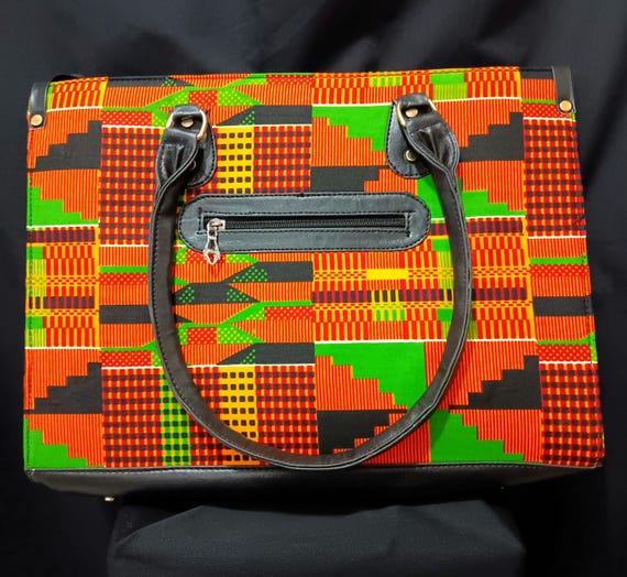 Africa Inspired Tote bag, beautiful African Fabric.  Zipper close top, front zipper pocket, leather hand handle. 20% OFF and FREE Shipping.