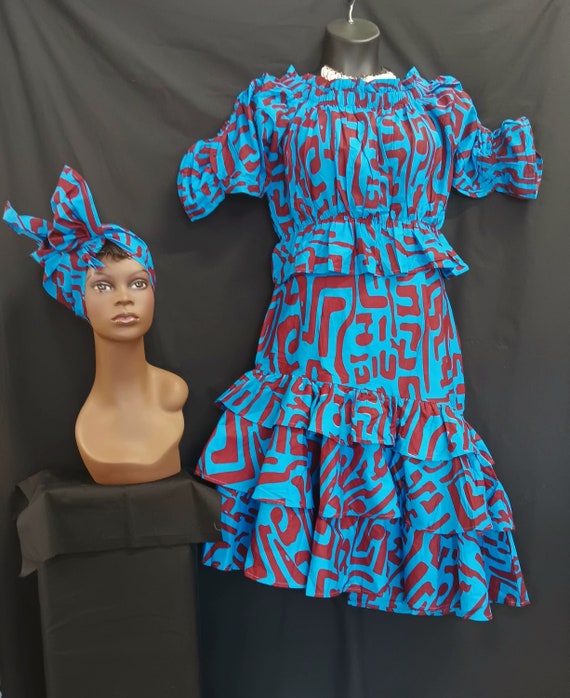 Africa print 3pc set, Elastic waist top with double ruffles bottom below knee length skirt with pockets and matching head wrap. Style KVZ 33