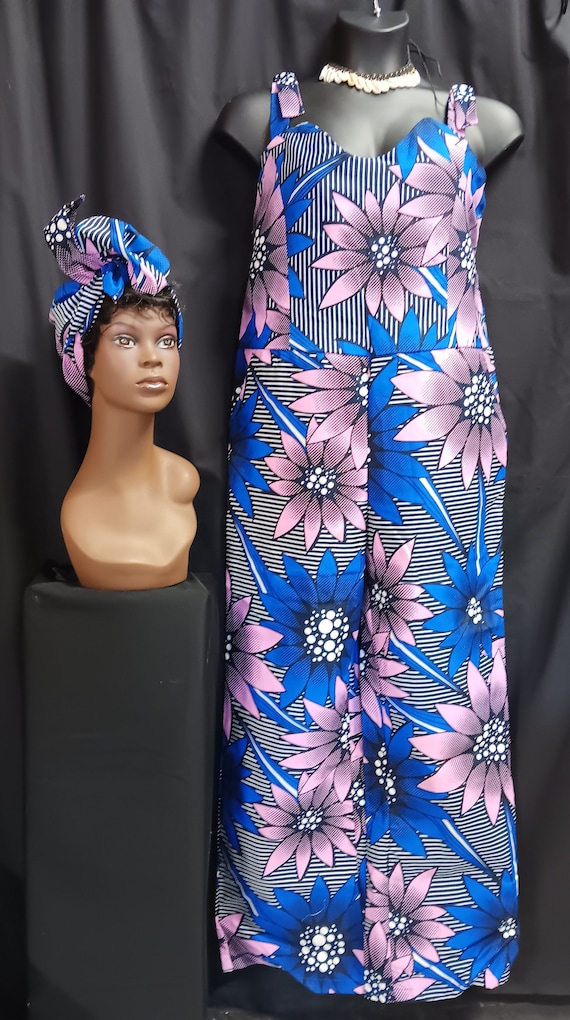 Africa print jumpsuit with matching headwrap. Made in Ghana, Africa. Adjustable shoulder straps and pockets. Zipper back, completely lined.