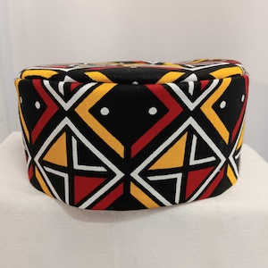 African kufi yellow, red, black and white print.