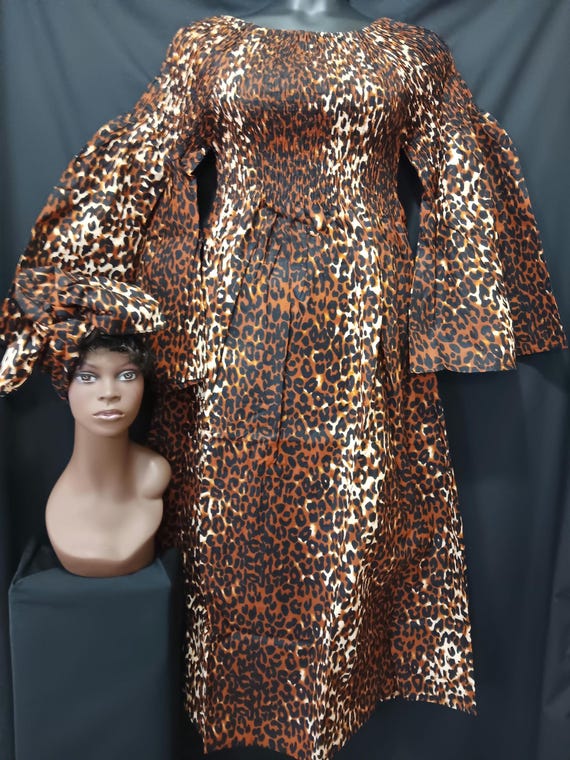 African print Dress. Elastic top to waist, pockets, long flowing full sleeves, ankle length, matching headwrap. 20% off. FREE Shipping.