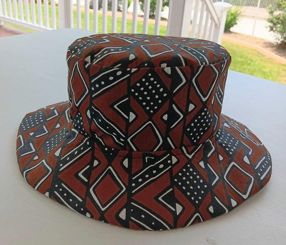 Africa inspired fabric Brim hat. Cotton fabric fully lined. Unisex. Colors are Brown, black and white. 20 %OFF and FREE Shipping.