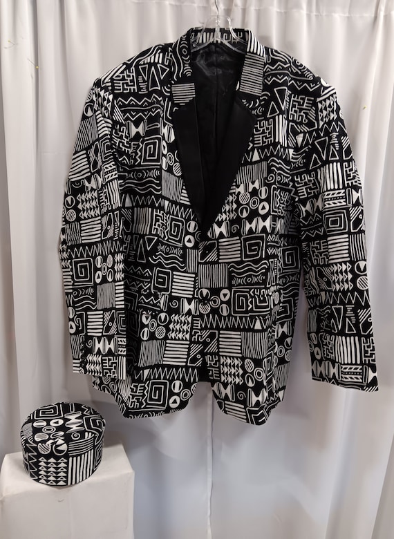 African Blazer jacket men's 85.00, African black and white print. 2 button, 3 pocket front. Black lining and lapels. 4 button sleeve.