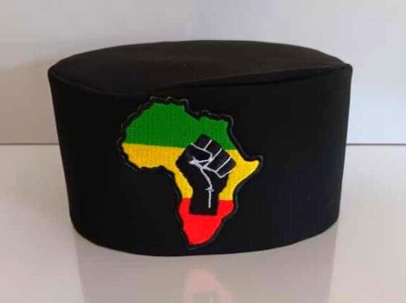African black Kufi hat with Unity fist on map of Africa patch green, yellow, red colors. RASTA
