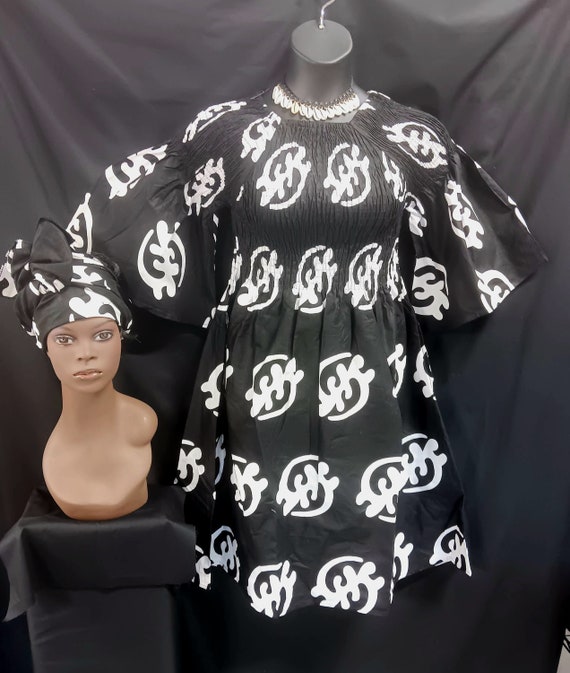 African print Dress. Elastic top to waist, pockets, elbow length full sleeves, below knee length dress with matching headwrap.