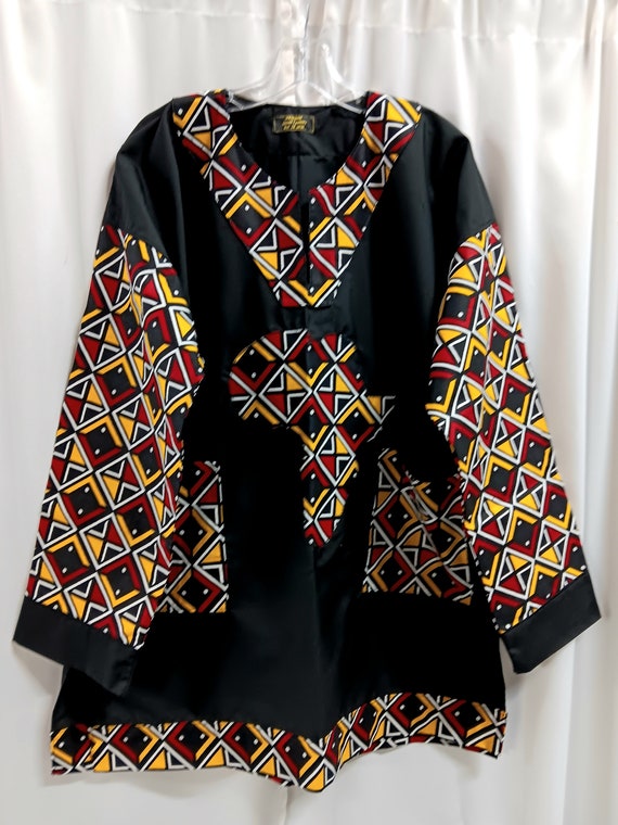 African Dashiki, map of Africa, colors black, red, yellow and white.Long black sleeves and pockets. Matching Kufi sold  separately.