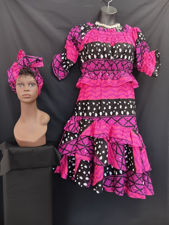 Africa print 3pc set, Elastic waist top with double ruffles bottom below knee length skirt with pockets and matching head wrap. Style KVZ 33