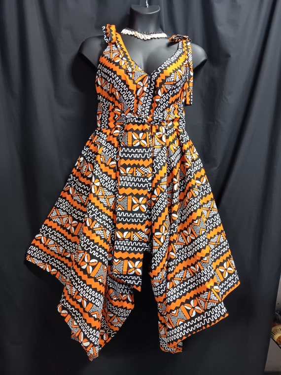 Africa print jumpsuit. Step-in tie at the shoulder and go. Wear with sandals or boots all season cutie. Lovely with top or leggins. Work it.