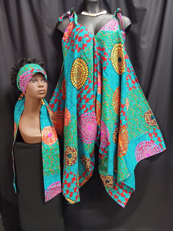 Africa print jumpsuit. Step-in tie at the shoulder and go. Wear with sandals or boots all season cutie. Lovely with top or leggins. Work it.