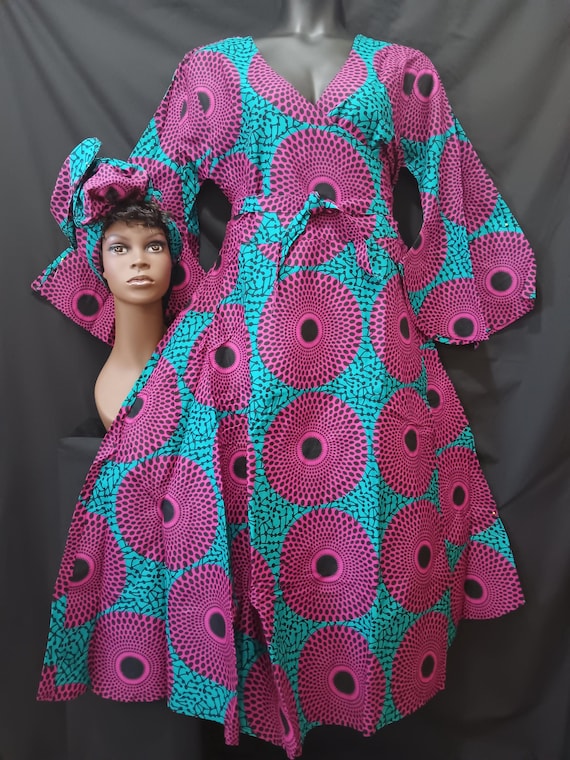 African print wrap dress with matching headwrap. Tie waist, Ankle length, long flowing sleeves. Lovely garment. 20% off. Free Shipping.