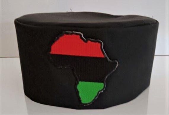 African Kufi Black hat with Map of Africa patch, red, black and green background.