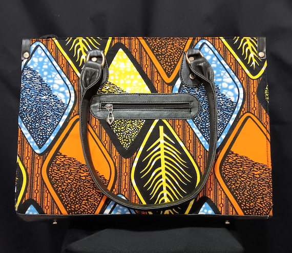 Africa Inspired Tote bag, beautiful African Fabric.  Zipper close top, front zipper pocket, leather hand handle. 20% OFF and FREE Shipping.
