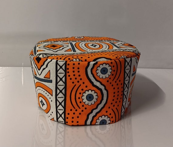 African print kufi hat. Colors orange, black and white African Fabric.  Matching dashiki sold separately.