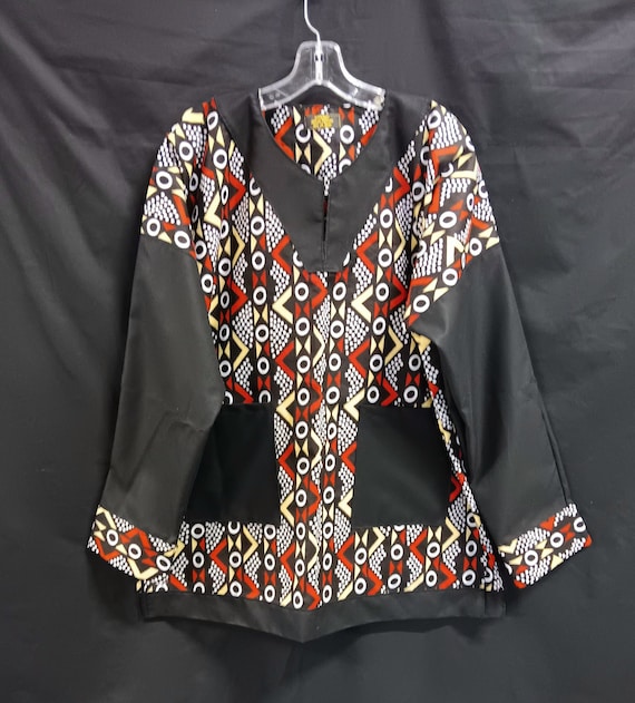 African Dashiki, black, dark reddish brown, yellow and white. Long solid black sleeves. Matching Kufi sold separately.