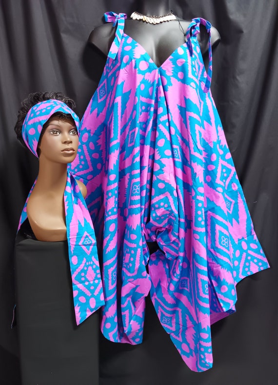 Africa print jumpsuit. Step-in tie at the shoulder and go. Wear with sandals or boots all season cutie. Lovely with top or leggins. Work it.