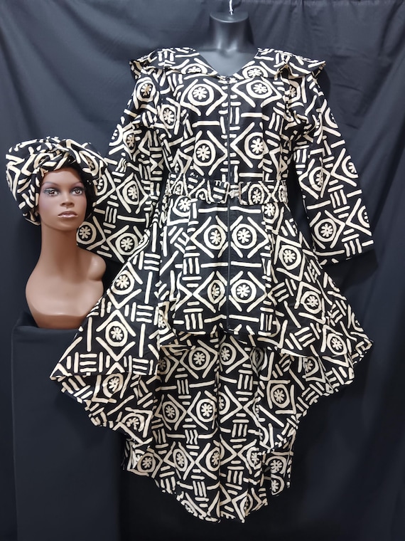 Africa inspired dress. High-low dress with matching Headwrap and cinch belt. Zipper front, long sleeves, pockets. 20% off and Free Shipping.