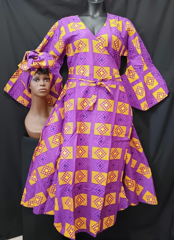 African print wrap dress with matching headwrap. Tie waist, Ankle length, long flowing sleeves. Lovely garment. 20% off. Free Shipping.