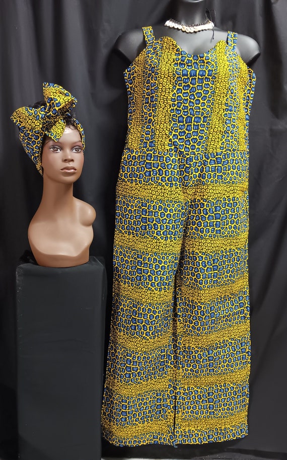 Africa print jumpsuit with matching headwrap. Made in Ghana, Africa. Adjustable shoulder straps and pockets. Zipper back, completely lined.