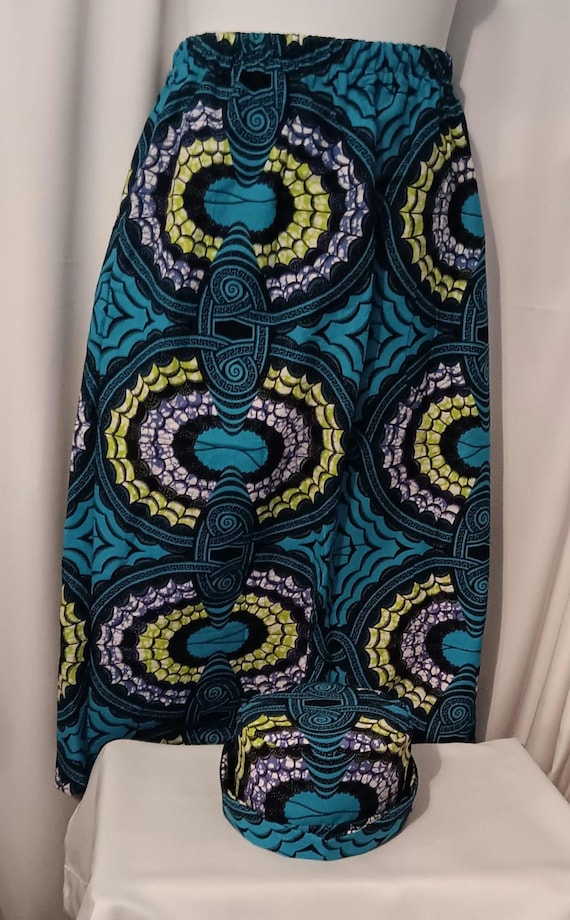 2pc Africa Print Skirt and matching bucket hat. Straight ankle length, and elastic waist skirt with pockets. Free Shipping, 20 % OFF.