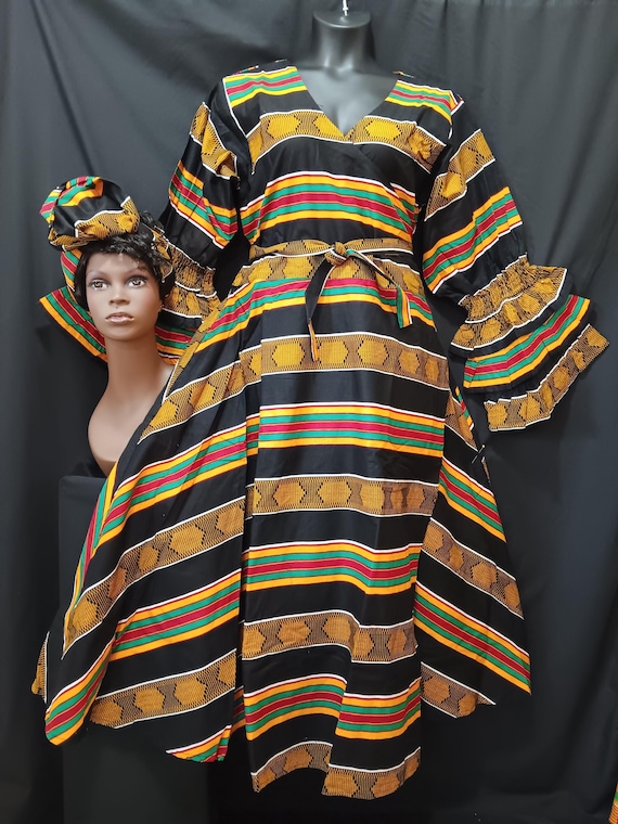 African print wrap dress with matching headwrap. Ankle length, long sleeves 3 ruffle sleeve bottom. Kente print. 20% off. Free Shipping.