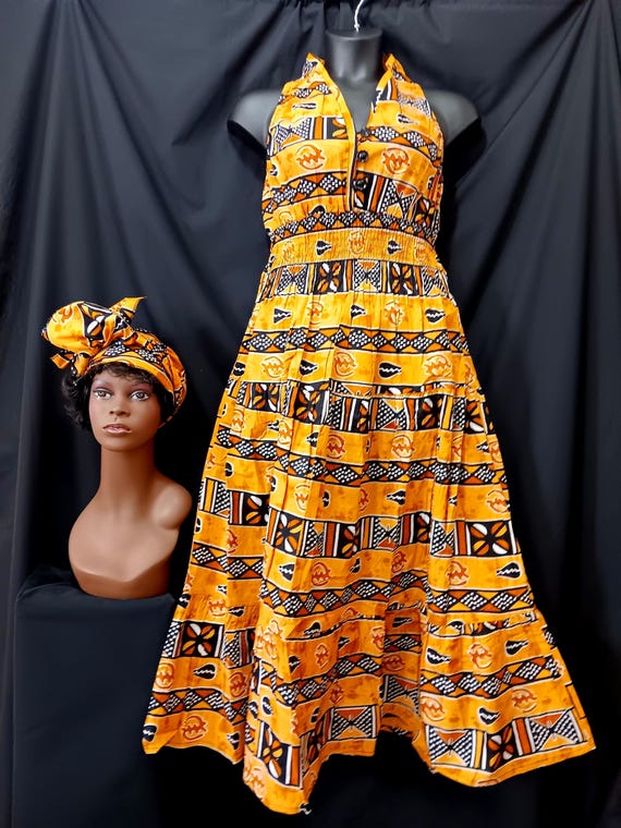 African print Dress and headwrap. Top Sleevess, halter neck, elastic back to waist, 3 button front, ankle length. 20% off and Free Shipping.