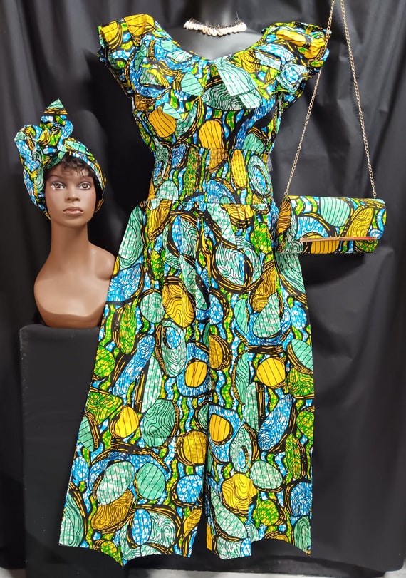 Africa print 3pc Jumper with headwrap and matching purse. Double collar sleeveless. Zipper back, Elastic waist, ankle length palazzo legs.