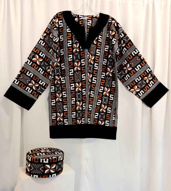 African Dashiki, black, white and golden brown long black sleeves trimmed in black cloth matching Kufi Print, sold as set or separately.