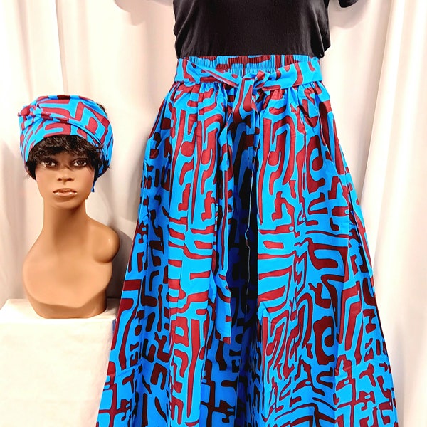 African women's Palazzo Pants. Royal blue, and plum purple African print with, tie waist belt, pockets and headwrap.