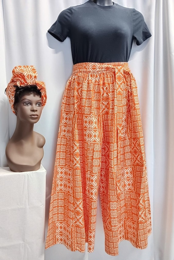 African women's Palazzo Pants, Pumpkin-Orange and White African print, tie waist belt, pockets and headwrap. 20% off and Free Shipping