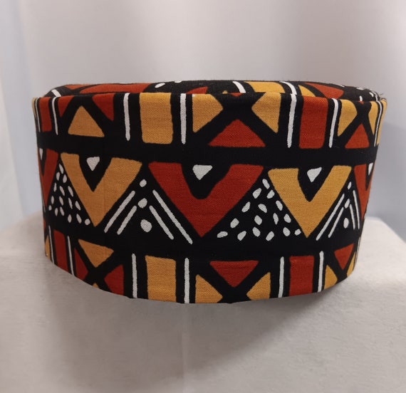 African kufi mustard gold, dark reddish brown, black and white print.
