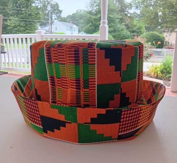 Africa inspired fabric Bucket hat, cotton fabric fully lined. Unisex. Kente print Orange,red green, black fabric. 20%OFF and FREE Shipping.