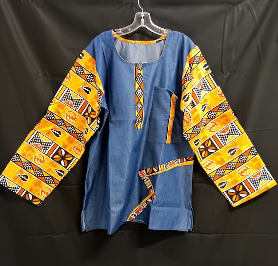 African inspired long sleeve shirt. African print and denim fabric makes nice contrast. Button down neck.